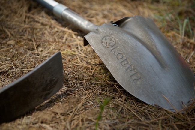 Shovels and picks laid out during a trail work day at Camp Sekani.