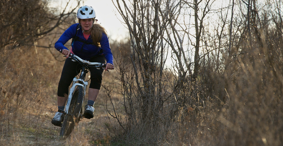 Female Mountain Biker Riding at Saltese Uplands.